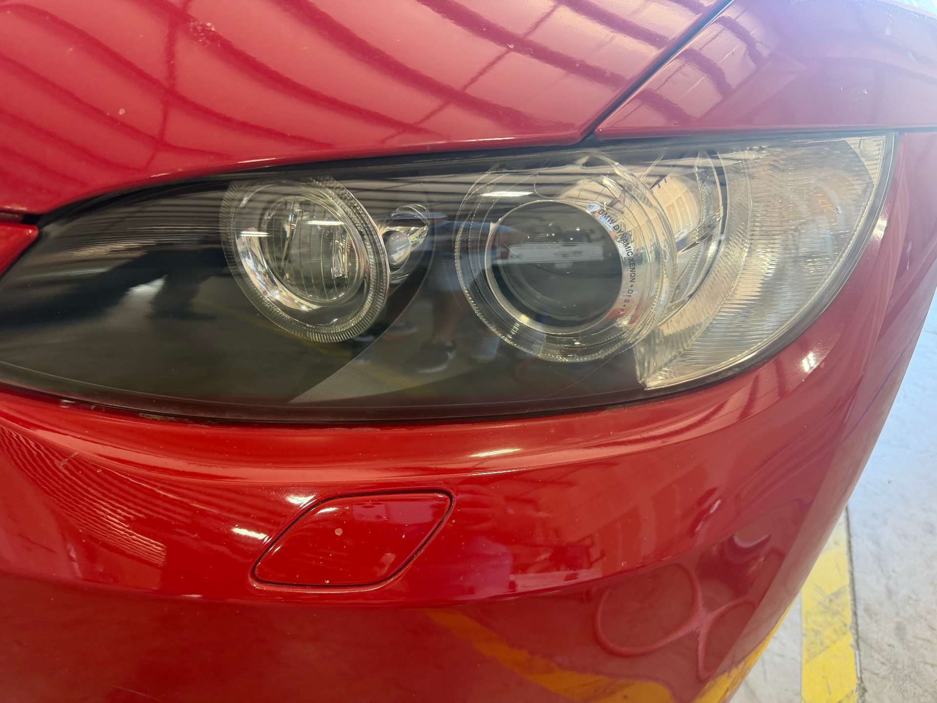 Restored crystal-clear BMW headlight after professional restoration
